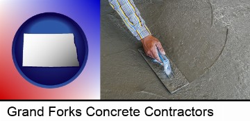 smoothing a concrete surface with a trowel in Grand Forks, ND