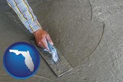 florida map icon and smoothing a concrete surface with a trowel