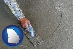 georgia map icon and smoothing a concrete surface with a trowel