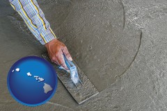 hawaii map icon and smoothing a concrete surface with a trowel