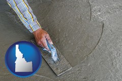 idaho map icon and smoothing a concrete surface with a trowel
