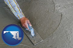 maryland map icon and smoothing a concrete surface with a trowel