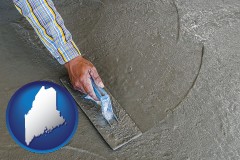 maine map icon and smoothing a concrete surface with a trowel