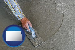 north-dakota map icon and smoothing a concrete surface with a trowel