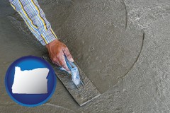 oregon map icon and smoothing a concrete surface with a trowel
