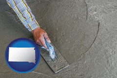 south-dakota map icon and smoothing a concrete surface with a trowel