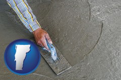 vermont map icon and smoothing a concrete surface with a trowel