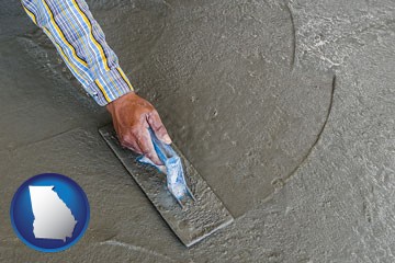 smoothing a concrete surface with a trowel - with Georgia icon