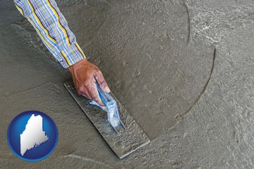 smoothing a concrete surface with a trowel - with Maine icon