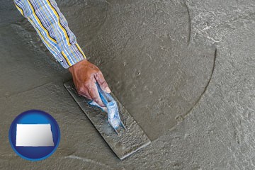 smoothing a concrete surface with a trowel - with North Dakota icon