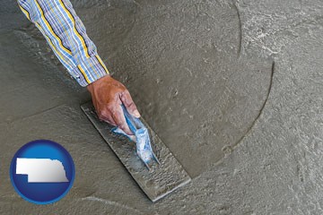 smoothing a concrete surface with a trowel - with Nebraska icon