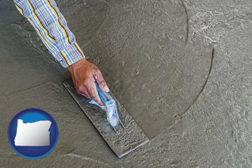 smoothing a concrete surface with a trowel - with Oregon icon