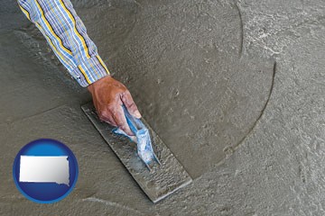 smoothing a concrete surface with a trowel - with South Dakota icon