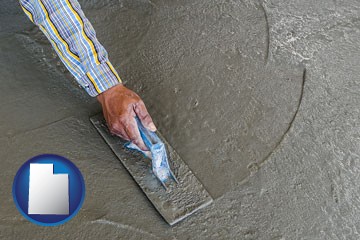 smoothing a concrete surface with a trowel - with Utah icon