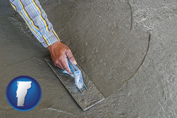 smoothing a concrete surface with a trowel - with Vermont icon