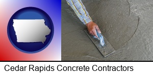 smoothing a concrete surface with a trowel in Cedar Rapids, IA